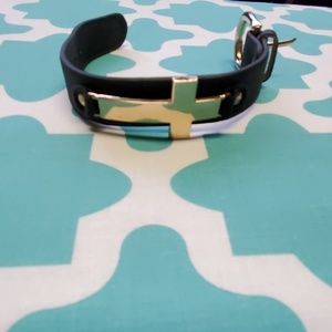 Black cross bracelet.
